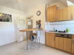 Küche mit Sitzgelenheit - Gemütliche 2-Zimmer-Dachgeschosswohnung in zentrumsnaher Lage von Lauf