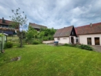 Garten mit Freisitz - Preiswertes Zweifamilienhaus in Simmelsdorf/Hüttenbach mit Garten und Nebengebäuden
