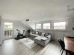 Wohn- und Esszimmer Ansicht 2 - Wohnen in der obersten Ebene! Schöne 3-Zimmer-DG-Wohnung mit Balkon & Garage in Neunkirchen-Speikern