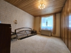 Schlafzimmer - Charmanter, teilsanierter Bungalow in Neunkirchen am Sand – ideal für Singles, Paare & Kleinfamilien